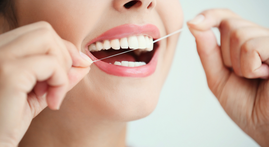 Flossing to help with Woman's oral health